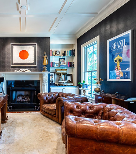 luxury room with couches and fireplace